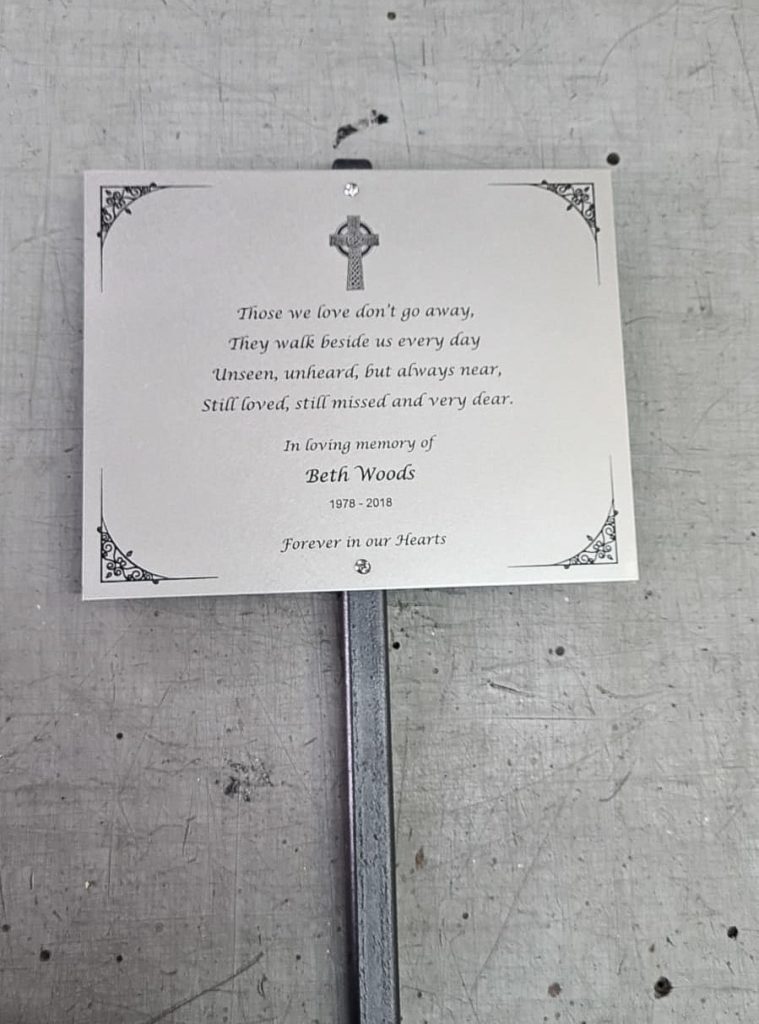 Christian metal plaque on pole for garden