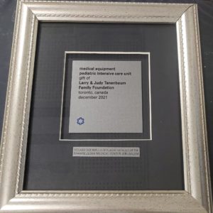 Plaque framed about medical equipment