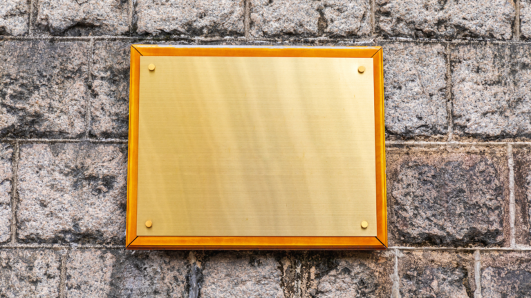 brass plaque mounted on a wall